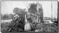 Russian Poles searching the ashes of their former home