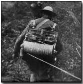 US signal battalion soldier stringing commo wire